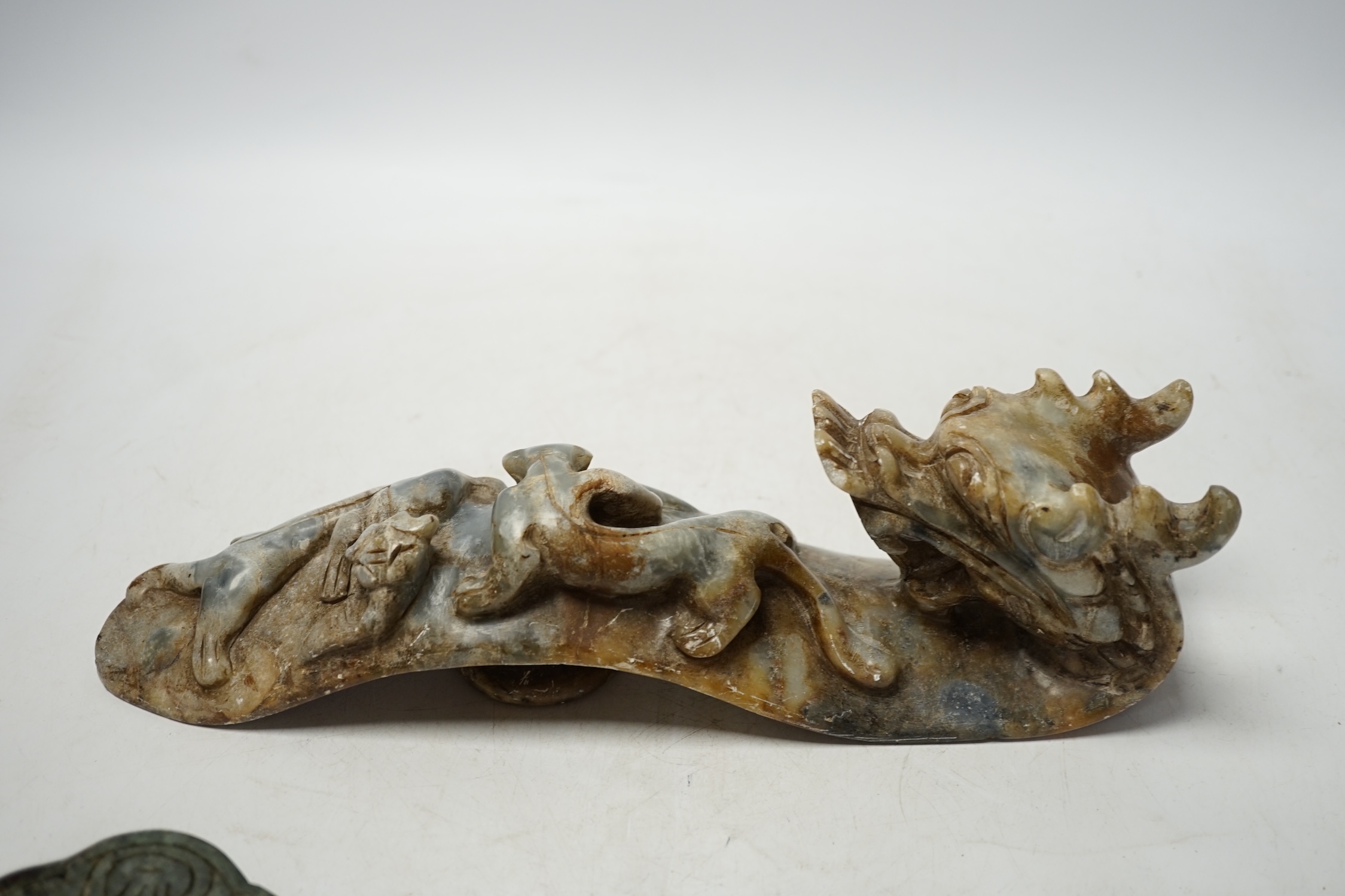 Two Chinese hardstone ruyi sceptres, one carved as a dragon, longest 30cm. Condition - fair